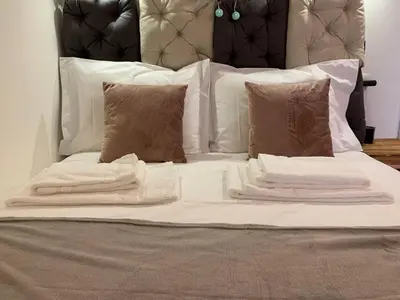 a bed with white blankets and pillows on it at SP199 Flat by in Porto