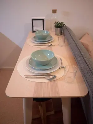 a table with two bowls and plates on it at SP199 Flat by in Porto