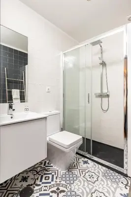 a bathroom with a shower and a toilet and a sink at Tito Studio Terrace in Porto