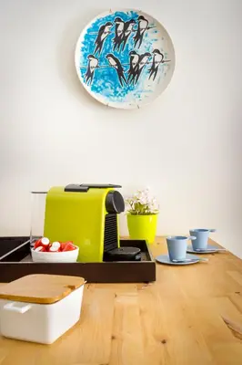 a kitchen with a counter with a plate on the wall at Exquisite Retreat in a Traditional Area of Porto in Porto