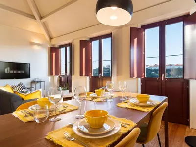 a dining room with a table with wine glasses at Domum 3 in Porto