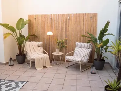 a living room with a couch and a chair at DA'HOME - Marquês Unique Terraza in Porto