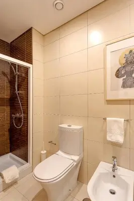 a bathroom with a toilet and a sink at DA'HOME - Marquês Unique Terraza in Porto