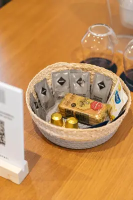 a basket of food sitting on top of a table at DA'HOME - Vitoria Duplex Apartment in Porto