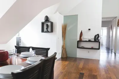 a dining room with a table and chairs at APOSENTUS - Downtown Porto Modern Penthouse in Porto
