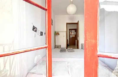 a room with a bed and a window at Ribeira Vintage Suite in Porto