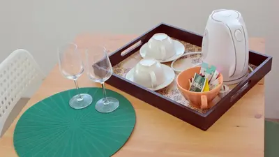 a tray with two wine glasses on a table at São João Oporto Residence I & II in Porto