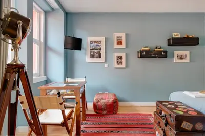 a room with a camera and a desk and a bed at VIVA Casa da Praça with Pool and terrace in Porto