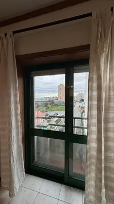 a window with a view of a city at Musica4 in Porto