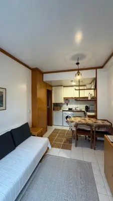a living room with a bed and a table in it at Musica4 in Porto