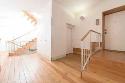an empty room with a staircase and a glass door at Fontainhas Design Apartment by DA'HOME in Porto