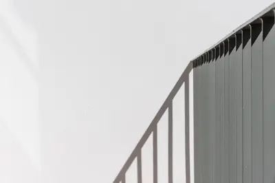 a tall building with a fence on the side of it at Backyard Palace Terrace in Porto