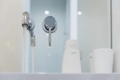 a bathroom sink with a faucet and a mirror at Backyard Palace Terrace in Porto
