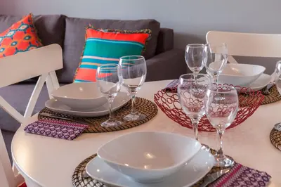 a table with plates and wine glasses on it at Casa do Antonio in Porto
