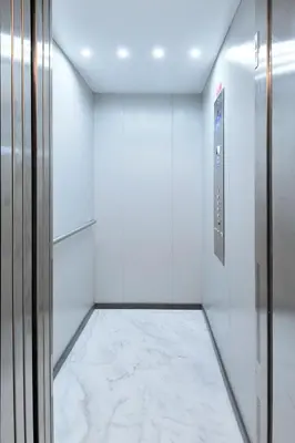 a walk in closet with white walls and a marble floor at FLH Almada Cozy Apartment with View in Porto