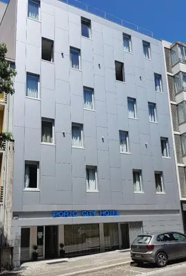a car parked in front of a forko city hotel at Porto City Hotel in Porto