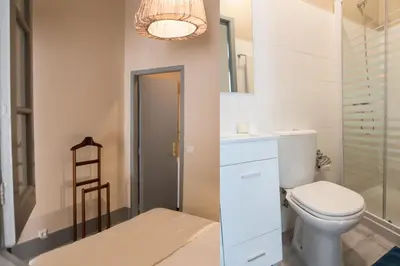 a bathroom with a toilet and a sink at RIBEIRA CHARMING APARTMENTS in Porto