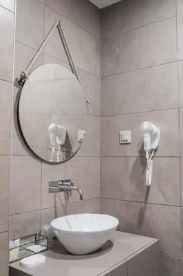a bathroom with a sink and a mirror at Olive Nature – Tourism Apartments in Porto