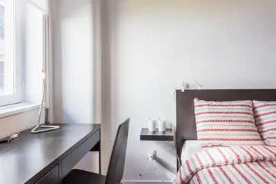 a bedroom with a desk and a bed at Alves da Veiga Apartments in Porto
