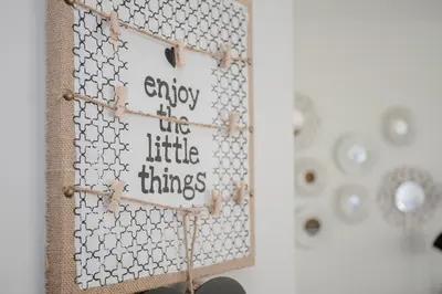 a sign that says enjoy two little things on a wall at Liiiving in Porto I Bright Light Studio in Porto