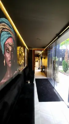 a room with a painting of a woman on the wall at Rubens Hotels & SPA in Vila Nova de Gaia