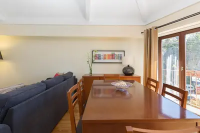 a living room with a table and a blue couch at OPO 52 in Porto
