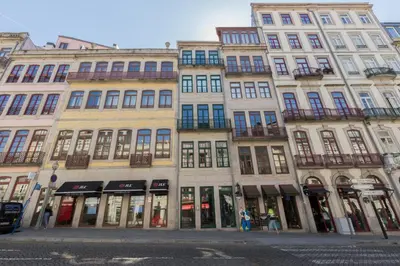 a group of tall buildings on a city street at OPO 52 in Porto