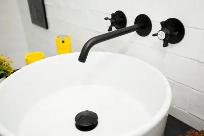 a bathroom sink with a faucet on a wall at GET a Cactus and Books studio in Porto