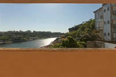 a view of the river from a balcony at Villa D'Ouro in Porto