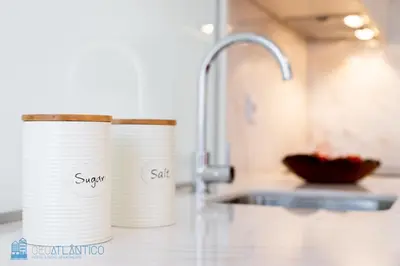 two stacks of paper cups sitting on a kitchen counter at Porto Garden Studio - Santa Catarina in Porto