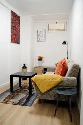 a living room with a couch and a table at River Flat I - Heart of Porto in Porto