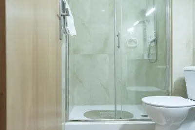 a bathroom with a shower and a toilet at D'OURO DONA MARIA By LW in Vila Nova de Gaia