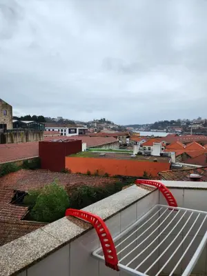 a red bench on top of a roof at D'OURO DOM LUÍS By LW in Vila Nova de Gaia