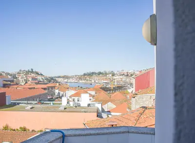 a view of a city from a balcony at D'OURO DOM LUÍS By LW in Vila Nova de Gaia