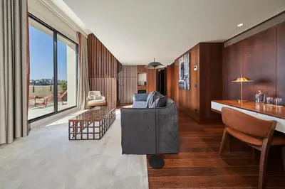 a living room with a couch and a table at PortoBay Flores in Porto