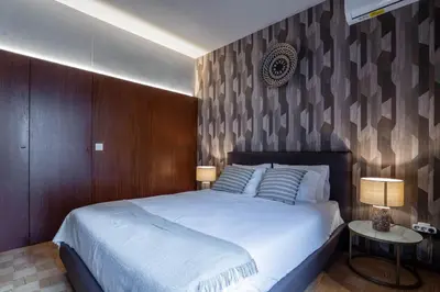 a bedroom with a large white bed and two lamps at Firmeza388 Charming Flats - Comfort & Privacy with 2 Bedrooms in Porto