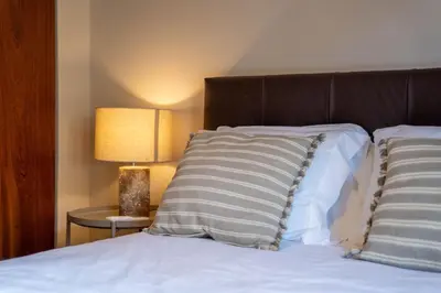 a bedroom with a bed with two pillows on it at Firmeza388 Charming Flats - Comfort & Privacy with 2 Bedrooms in Porto
