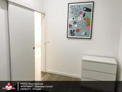 a white room with a painting on the wall and a drawer at Downtown Fantail in Porto