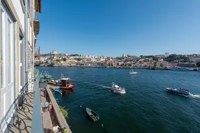 a view of a river with boats in the water at Porto Premium River View II in Porto