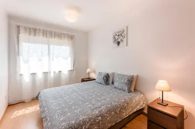 a bedroom with a bed and a window at Porto City Experience in Porto