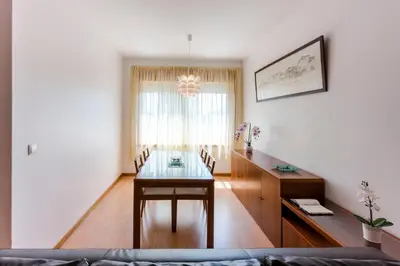 a dining room with a table and a desk at Porto City Experience in Porto