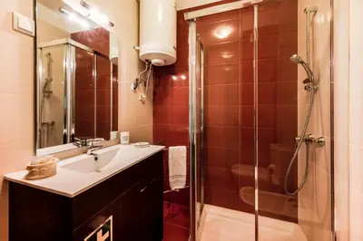 a bathroom with a sink and a shower at Porto City Experience in Porto