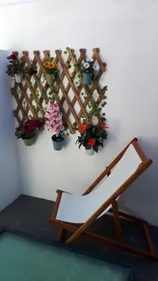 a room with potted plants on a wall at TMB (Train / Metro& Bus ) Oporto Station House in Porto