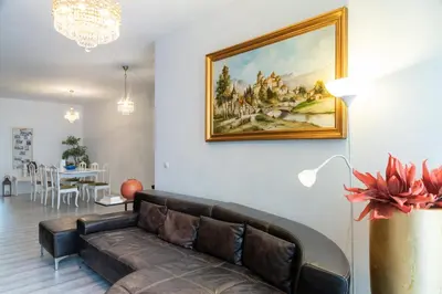 a living room with a couch and a painting on the wall at River Flat IV - Heart of Porto in Porto