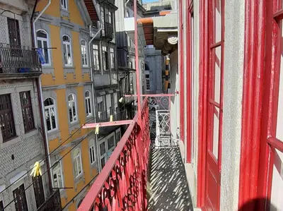 a view from a red balcony of a building at River Flat IV - Heart of Porto in Porto