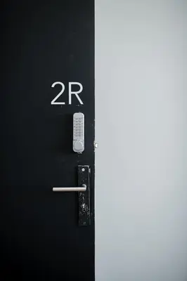 a black door with the number on it at Baixa24 •P2R• Bright Apt in Vibrant Downtown in Porto