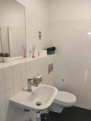 a white bathroom with a sink and a toilet at Baixa24 •P1R• Brand New Apt in the Historic Center in Porto