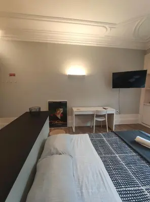 a bedroom with a large bed and a table at Baixa24 •P1R• Brand New Apt in the Historic Center in Porto