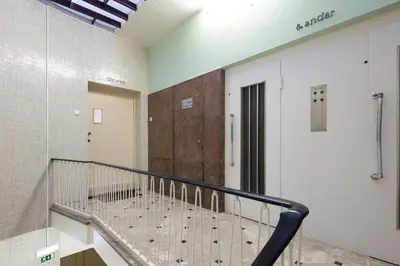 a staircase in a prison cell with a door and a stair case at LovelyStay - Penthouse Balcony Apartment in Porto