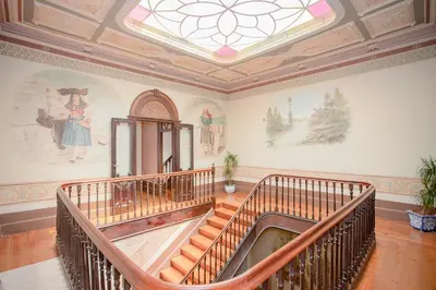 a staircase in a building with a skylight at Palace Museum & National Monument - Espaço Palmeiras in Porto